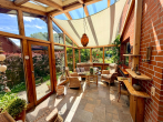 EG Wintergarten - Einfamilienhaus auf Eigenland in Moisling/Niendorf mit Wintergarten, Doppelgarage und großem Garten