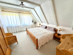 OG Schlafzimmer - Einfamilienhaus auf Eigenland in Moisling/Niendorf mit Wintergarten, Doppelgarage und großem Garten