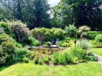 Garten Teich - Einfamilienhaus auf Eigenland in Moisling/Niendorf mit Wintergarten, Doppelgarage und großem Garten